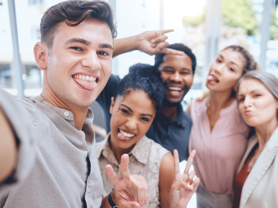 diverse contact center reps taking a group photo pic groupfie