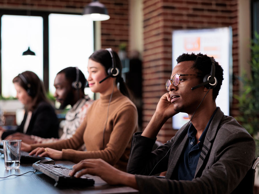 diverse customer support team in call center assisting consumers
