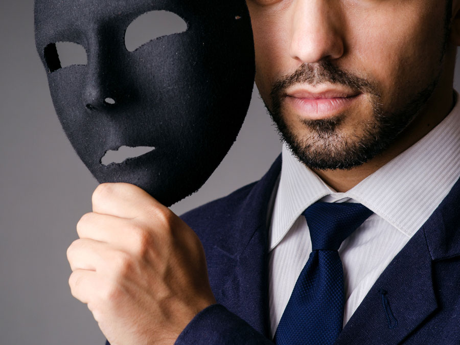 ecommerce fraud cybercriminal businessman fake identity mask