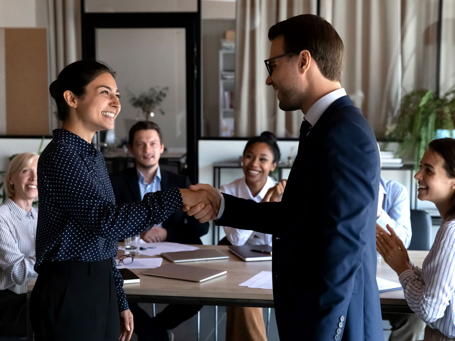 emotional intelligence depiction call center executives shaking hands with customer service team