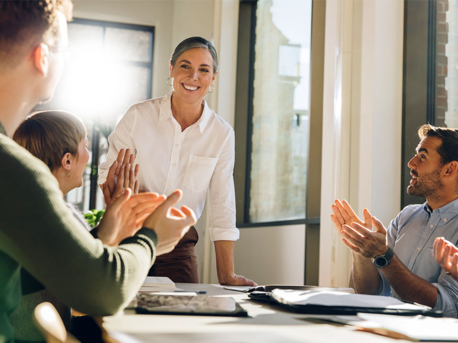 employee self-care depiction customer service team applauding call center agent 