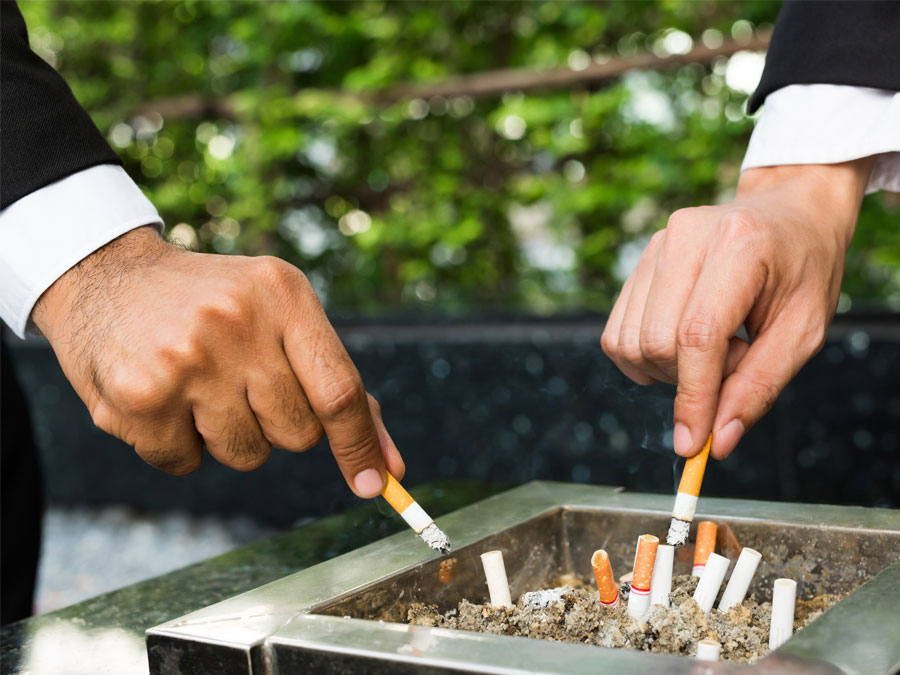 employee self-care strategy call center agents quit smoking cigarette butts in smoking area ash