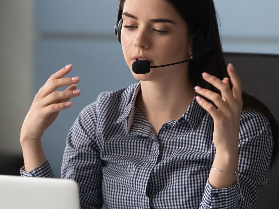 excellent customer satisfaction rep guiding customer over the phone in call center 