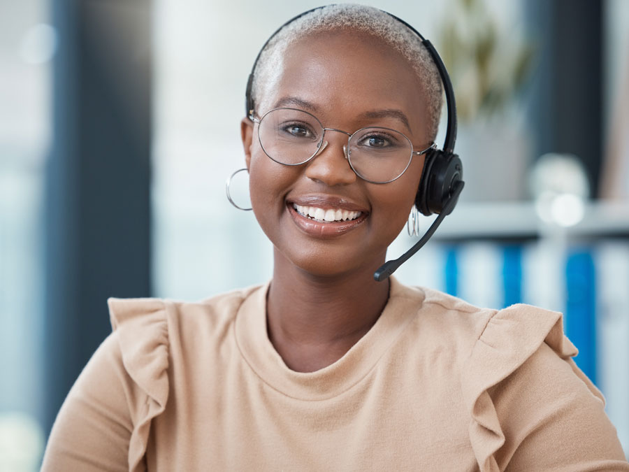 loyal contact center agent smiling in customer service office