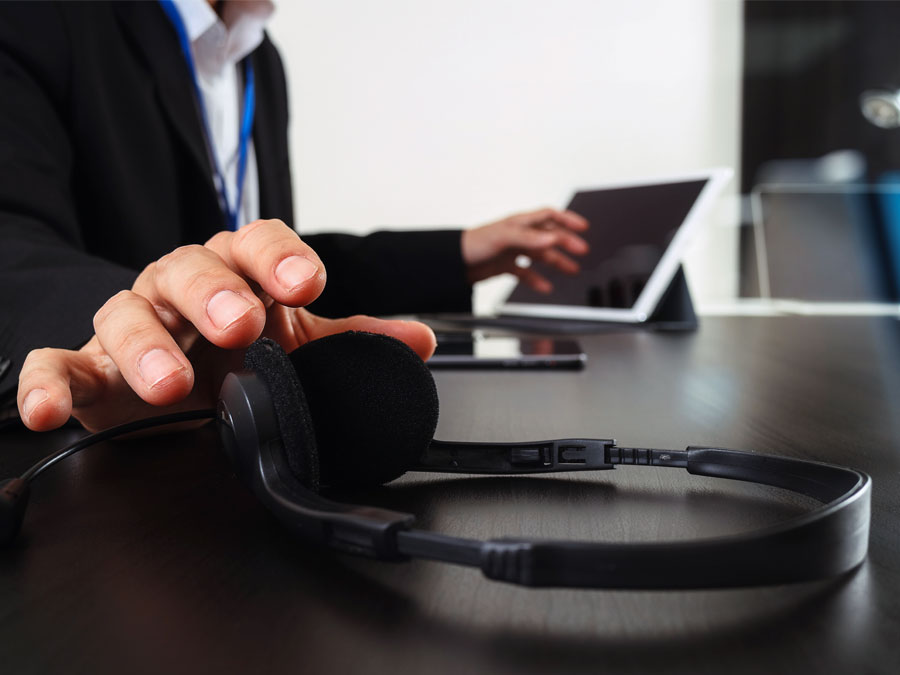multichannel team customer support call center agent reaching headphones