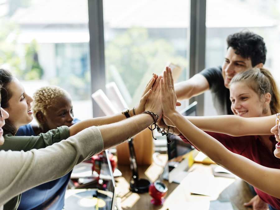 multilingual call center team building high five