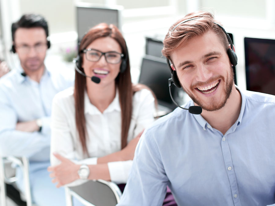 Call Center Agent Experience depiction smiling customer support reps at the office
