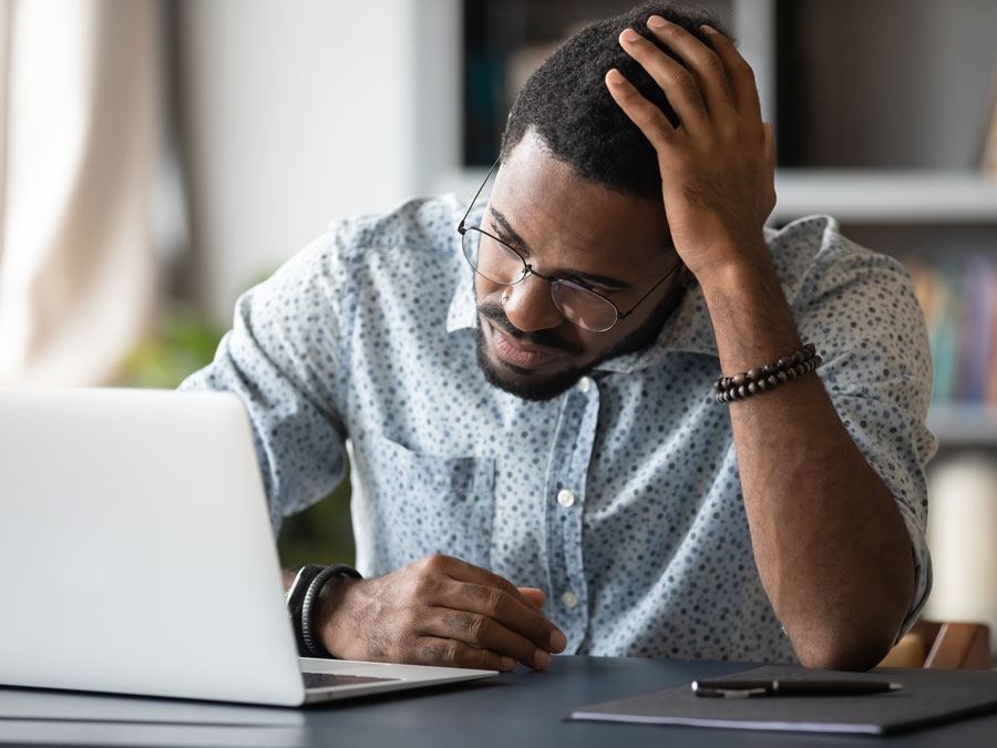 social media content moderation expert evaluating analyzing website on laptop