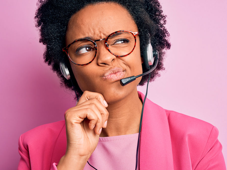 technical support call center agent listening intently to customer