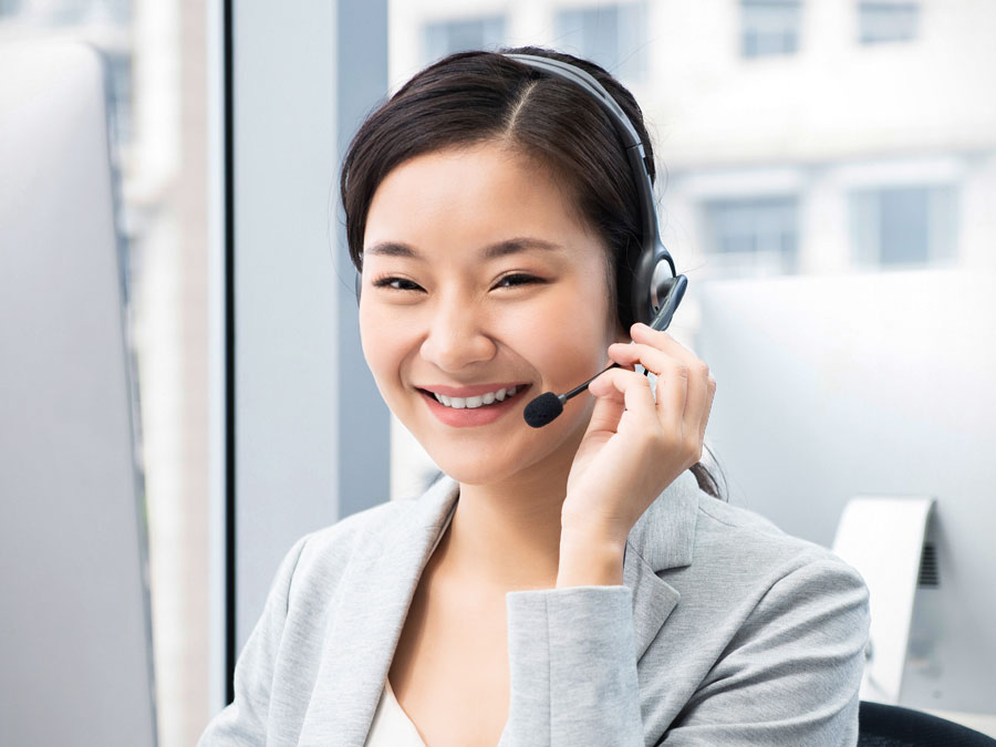 telemarketing agents smiling holding headset 