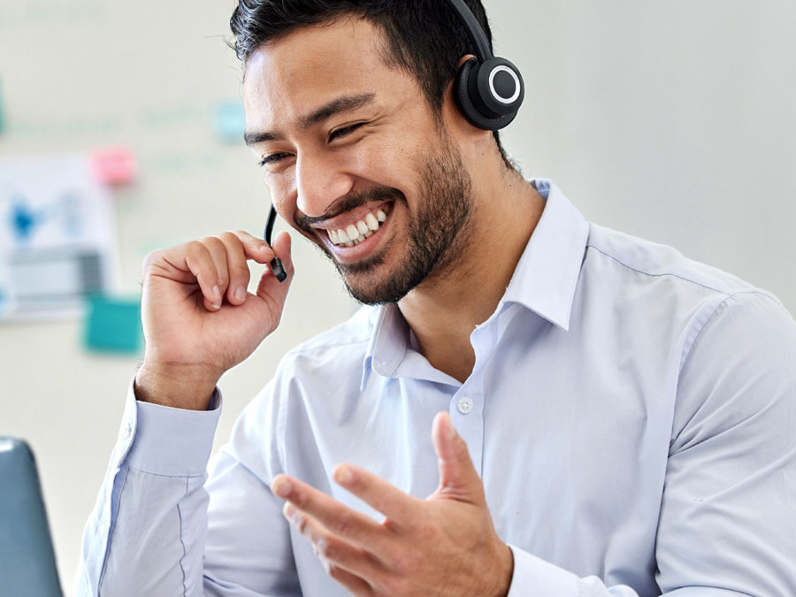 telemarketing agents smiling speaking to prospect on the phone