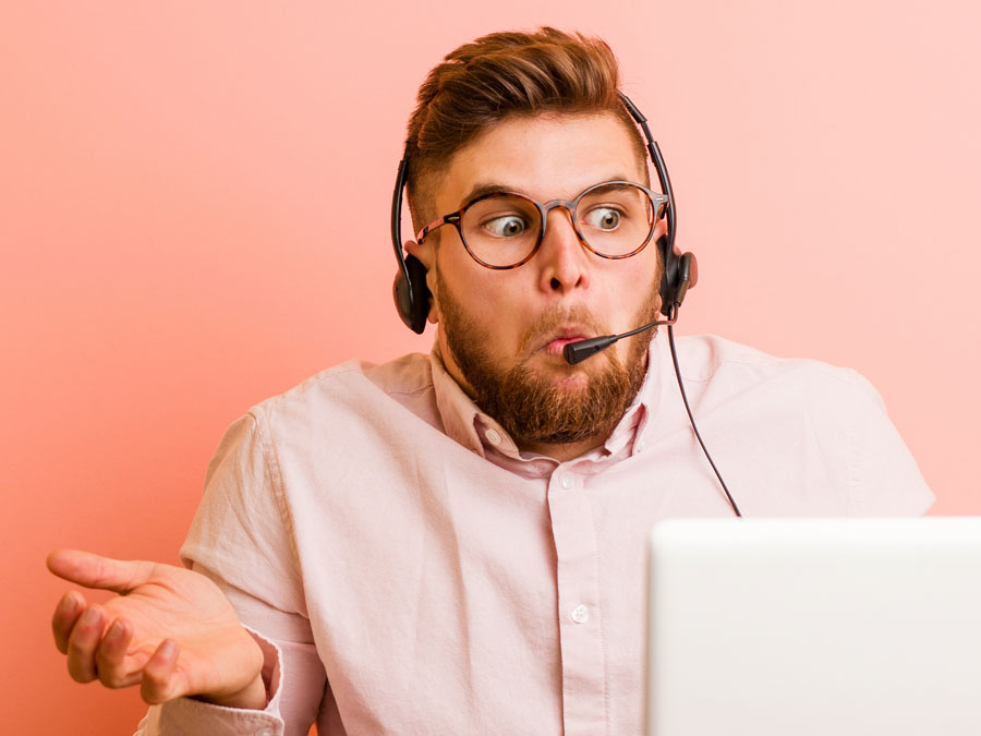 unsure call center agent looking confused at laptop