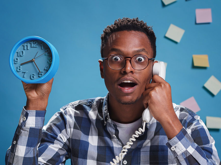 voice of the customer depiction man on the phone holding clock