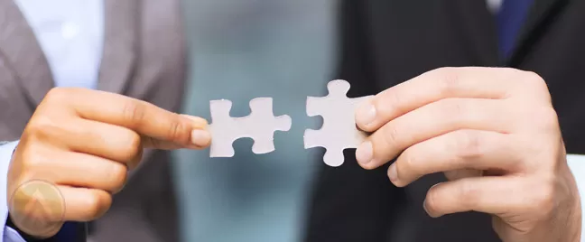 male-hands-with-puzzle-piece