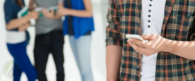 teens-tweens-holding-mobile-phones-smartphones