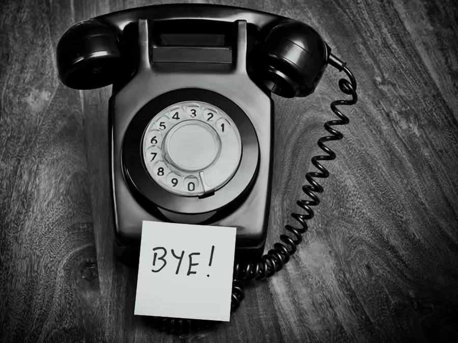 customer attrition depiction landline telephone with post it written Bye