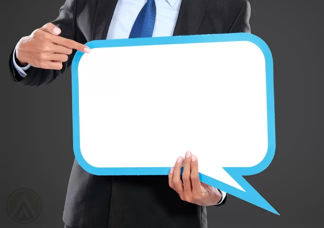 businessman-holding-word-balloon