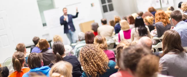 audience-listening-to-speaker
