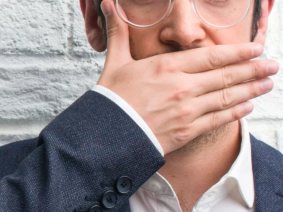 ecommerce businessman covering mouth
