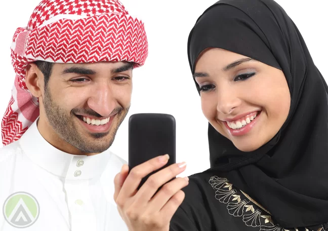 male-female-arabic-smiling-enjoying-smartphone-social-media