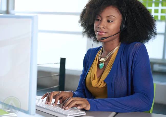 ethnic-female-customer-service-agent-typing-on-computer
