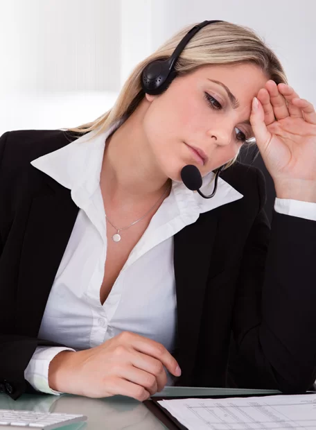 tired-frustrated-female-call-center-agent-reading-document