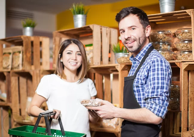 grocery shopkeeper assisting customer