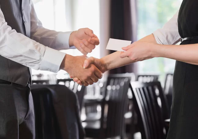 restaurant waitress giving customer business card