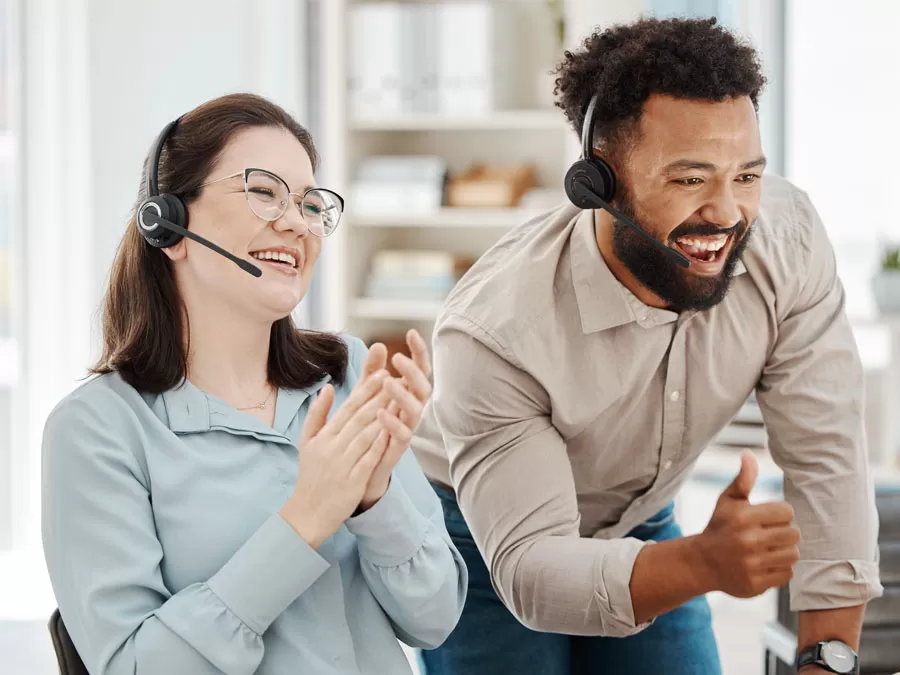 outsourced call center leadership happy employees applauding in customer service contact center
