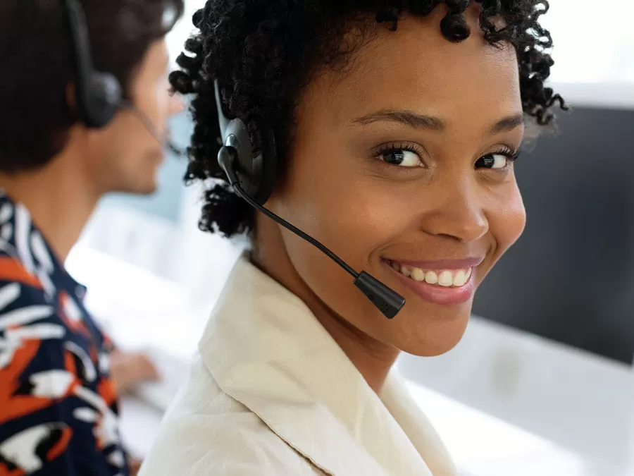 smiling customer service agent in call center