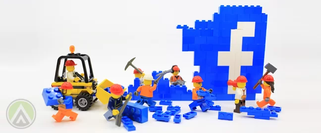Lego minifigs wrecking down facebook wall