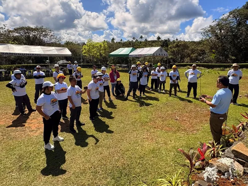 Open Access employee volunteers attend a briefing before planting native tree saplings in Laguna during the Plant It Forward drive.