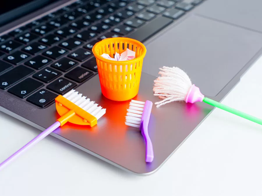 content moderation spam fake news depiction cleaning material on laptop